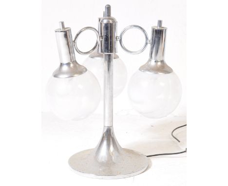 A retro vintage mid 20th century circa 1970s chrome chandelier having scrolled arms terminating in circular glass shades. 55c