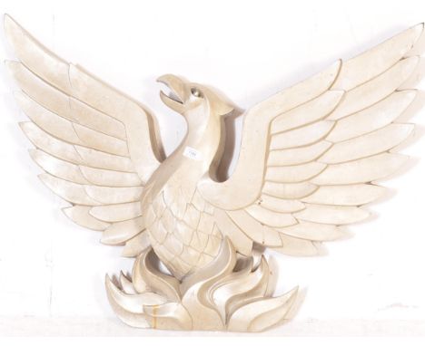 A vintage 20th Century fibreglass architectural salvage Phoenix. The wall mounted wall plaque / decoration depicting a Phoeni