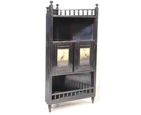 A 19th century Victorian ebonised&nbsp; aesthetic movement corner cabinet in the manner of Liberty of London. The cabinet&nbs