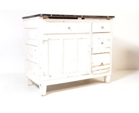 A vintage retro mid 20th century farmhouse oak whistle painted and enamel top kitchen unit. The unit of a rectangular form ha