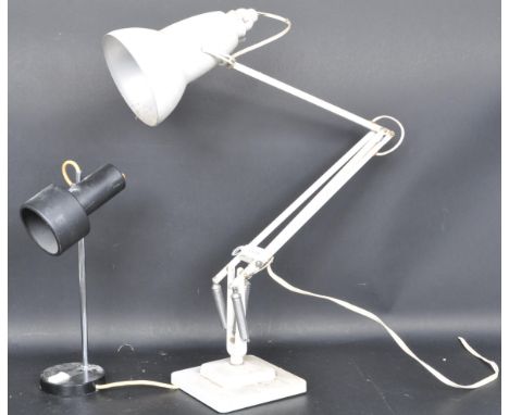 A 20th Century circa 1940's Industrial pre-war Herbert Terry anglepoise lamp, raised on a cast metal two step base with penda