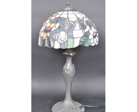 A 20th century vintage retro Art Nouveau Tiffany style desk lamp / table lamp. The lamp having a multicolour panel glass shad