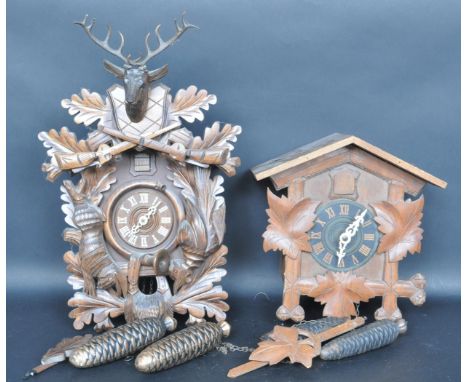 Two vintage late 20th century Black Forest / German / Swiss mechanical 8 day Cuckoo clock. The clock having a Swiss Cottage s