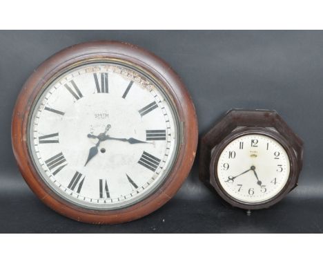Two 20th century wall hanging clocks / station clock. One having a white dial with Roman numerals to the chapter ring set in 
