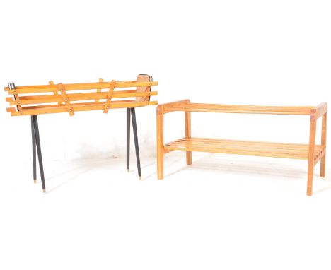 A vintage retro 20th Century planter / plant stand trough having a slatted teak wood body with melamine side raised on eboniz
