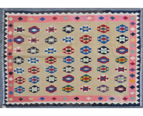 A mid 20th century wool on wool hand knotted southwest Persian / Iran Qashgai Kilim rug / carpet. The rug having a light crea