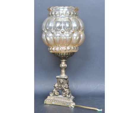 A mid 20th century brass table lamp / desk lamp. The lamp having a pressed glass spherical light shade decorated with embosse