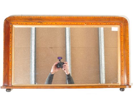 A Victorian 19th century walnut overmantel mirror. Raised on ceramic bun feet with a cushion mirror having tunbridge inlaid s