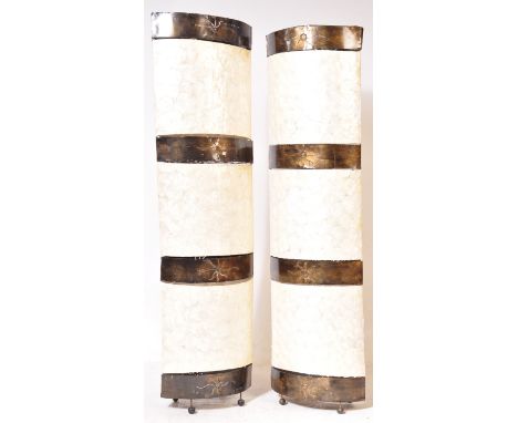 A pair of contemporary floor standing lamp shades of an unusual tall form decorated with pierced metals and mother of pearl s