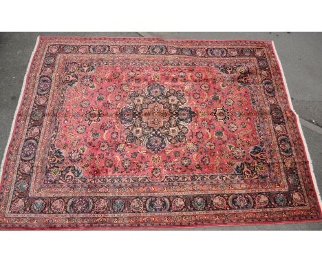 A large mid 20th century wool on cotton hand knotted northeast Persian / Iran Signed Meshed carpet / rug. The carpet having a