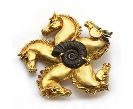 An 18ct gold horse wheel design brooch, by Harriet Glen,designed as a wheel or five point star, with an ammonite claw set to 