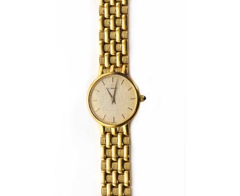An 18ct gold ladies' Eterna quartz bracelet watch,with a circular case, 23mm diameter, a silvered textured dial, gilt baton i