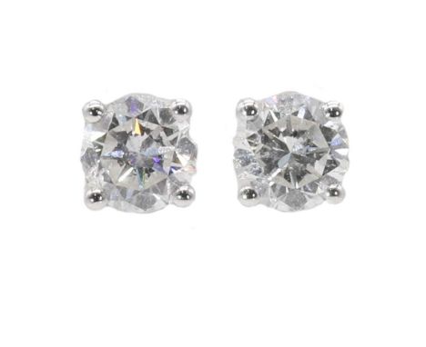 A pair of single stone diamond stud earrings, with a stated total diamond weight of 1.20ct. Each brilliant cut diamond with a
