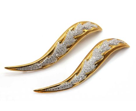 A pair of Continental diamond set two colour gold flame or leaf brooches, with raised central sections, pavé set with graduat