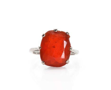 An early 20th century large cushion cut fire opal ring, c.1915, a cushion cut cherry red fire opal, approximately 14.00 x 11.