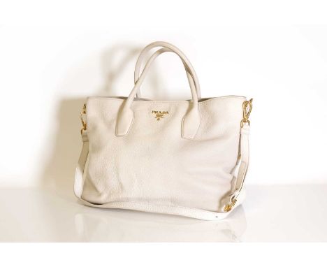 A Prada cream leather shopper tote,dual rolled handles, gold tone hardware, detachable shoulder strap, interior zip and slip 