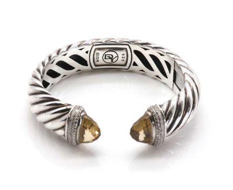 A sterling silver diamond and citrine set hinged torque bangle, by David Yurman,the 'D' section bangle of twist rope design t