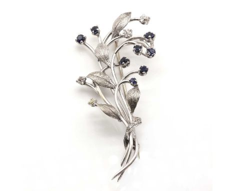 A cased diamond and sapphire set spray brooch,modelled as a foliate spray set with circular cut sapphires, old mine cut diamo