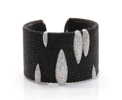 An 18ct white gold diamond set shagreen cuff style torque bangle, by de GRISOGONO,  with graduated raised pear shaped section