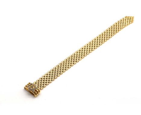 An 18ct gold diamond set jarratière bracelet, by Nathan Brothers, c.1970,four rows of panther links with an adjustable hinged