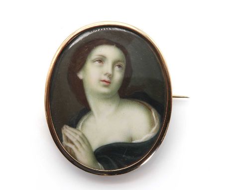 A painted portrait miniature brooch, in the style of Guido Reni, depicting a woman, possibly Mary Magdalene, holding her hand