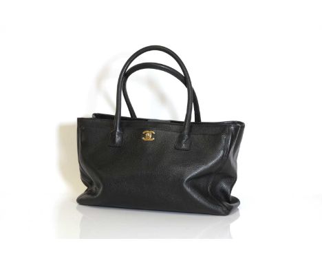 A Chanel black leather Executive shoulder bag,dual rolled handles, detachable shoulder strap, gold tone hardware, magnetic cl