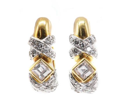 A pair of 18ct gold diamond cuff style earrings, by Mappin &amp; Webb, a princess cut diamond off set to the centre, with dia