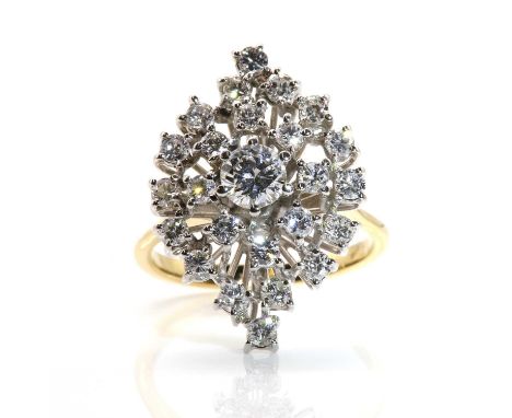 A diamond set marquise shaped cluster ring,  with a brilliant cut diamond claw set to the centre, with a dispersed cluster of