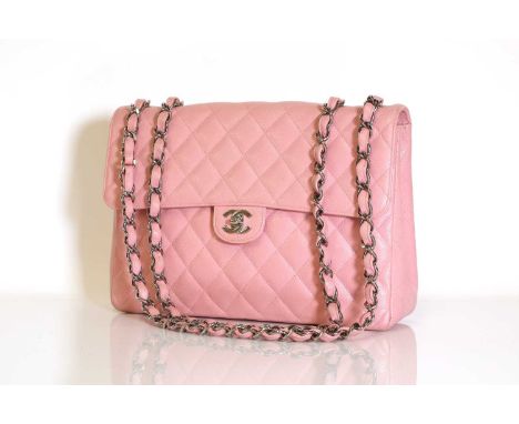 A Chanel pink caviar leather jumbo flap bag, silver tone hardware, CC front lock closure, interior zip and slip pockets, auth