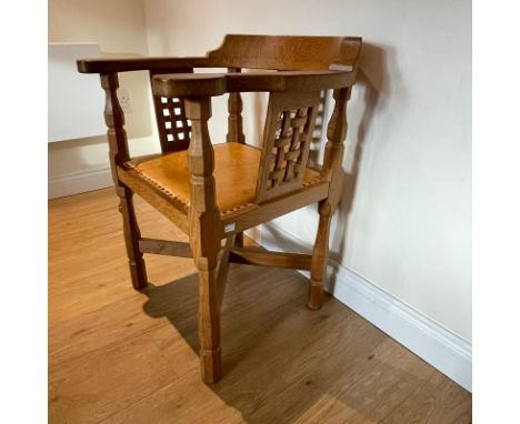 Robert "Mouseman" Thompson carved oak armchair with leather seat with studded edge. Approximately 63cm wide and overall heigh