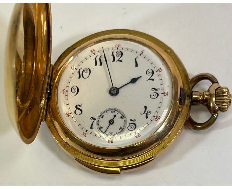 An 18ct gold ladies full hunter pocket watch. With a white enamel dial, with black and red roman numerals and a secondary dia