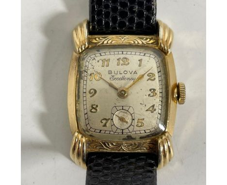 A gold filled Bulova Excellency manual wind wristwatch with a 26mm case, running, crack to glass otherwise reasonably good