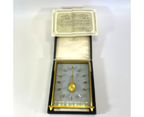 A Jaeger-LeCoultre 1968 floating skeleton mantel clock with a brushed gilt rectangle case. Approximately 16.5cm by 4cm by 20.