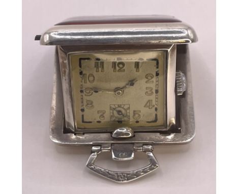 A German 800 silver Art Deco guilloche enamel folding travel clock. With a square dial with Art Deco Arabic numerals, with a 