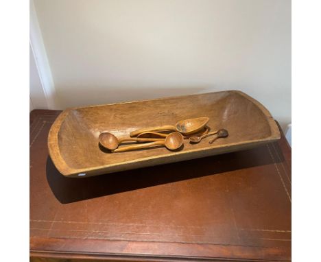 Large carved wooden trough, approximately 111cm wide together with 6 carved wooden spoons. Old worm to trough. Metal repair t