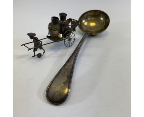 A silver ladle, Walker Hall Sheffield 1889/1890. Approximately 31 cm long and 288 grams. No engraving. Generally good. Plus a