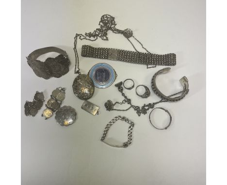 A collection of antique and vintage silver and white metal jewellery. Comprising an ornate engraved bracelet, with a pin and 