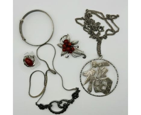 A collection of silver jewellery. To include a red coral spray brooch, marked "silver"; a red coral dress ring, with Chinese 