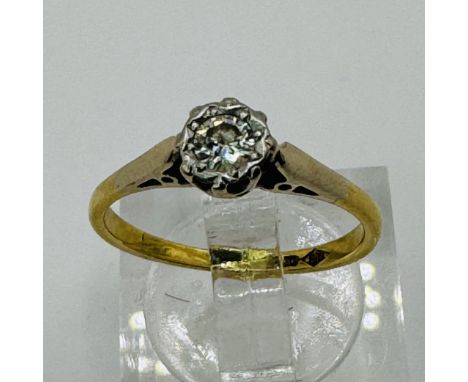 An illusion set 0.10 carat diamond solitaire ring in yellow precious metal. Marked "HS 18ct" to the shank. Tests as 18ct gold