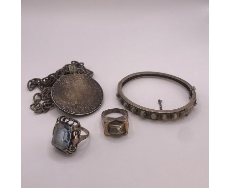 A collection of white metal jewellery. Comprising a chatoyant cabochon paste set hinged bangle;&nbsp; a Marie Therese Thaler,