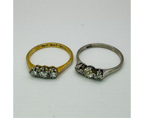 Two early 20th century diamond three stone rings. One a&nbsp;three stone diamond "18ct" stamped white precious metal ring rin