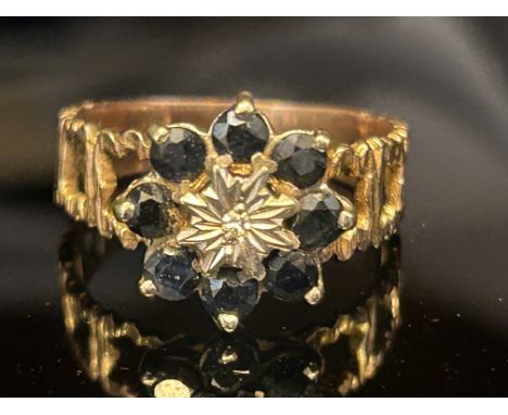 9ct Gold ring set with sapphires & small central diamond Size P 3.3g