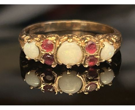 9ct Gold ring set with 3 opals & 4 garnets 2.9g Size Q