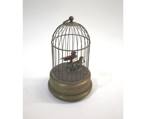 BIRD AUTOMATON a bird cage wound from the base which operates two birds inside. 28cms high 