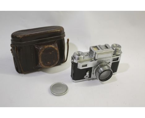 ZEISS IKON CONTAX CAMERA & LEATHER CASE a Contax camera with built in light meter and shutter speeds to 1250. With a Zeiss Je