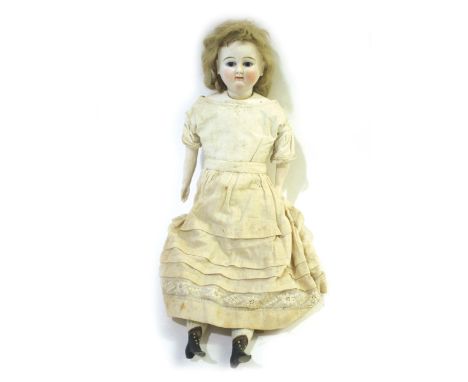 BISQUE HEAD DOLL a shoulder plate swivel head doll, with fixed blue eyes and pierced ears, and with bisque arms and legs. Unm