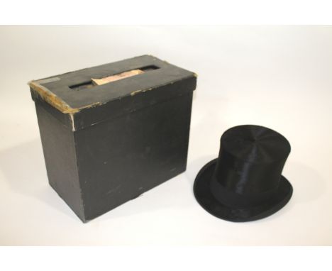 BOXED TOP HAT a black Top Bat by Bates, Jermyn St, London, in a fitted box by the same maker. Also with a vintage leather sui