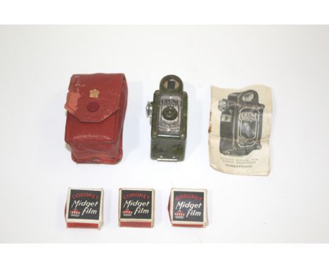 CORONET MIDGET CAMERA  a Coronet Midget Camera in a green marble effect case, with it's red leather pouch and instruction lea