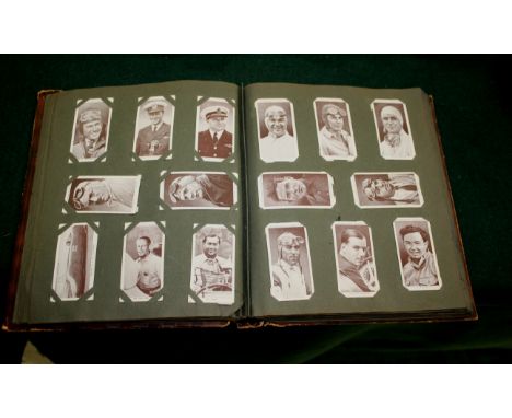 ALBUMS OF CIGARETTE CARDS a mixed lot including John Player Footballers Caricatures, Wills Roses, John Players Straight Line 