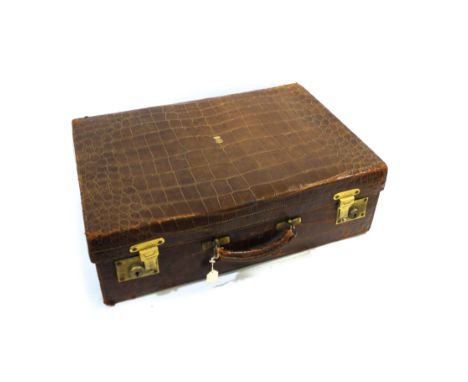 CROCODILE SUITCASE & FITTINGS - ASPREY a crocodile skin suitcase with brass clasps and initials on the top, with a fitted int